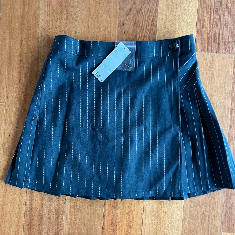 Pin stripped skirt , pleats in back